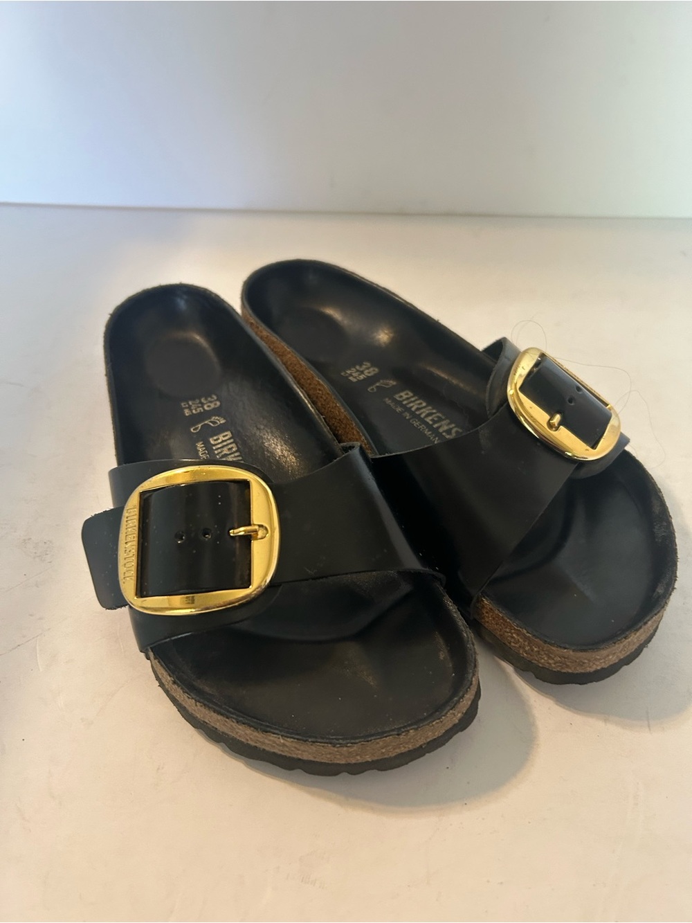 Birkenstock - 38W Black Single Strap Slides with Gold Buckles